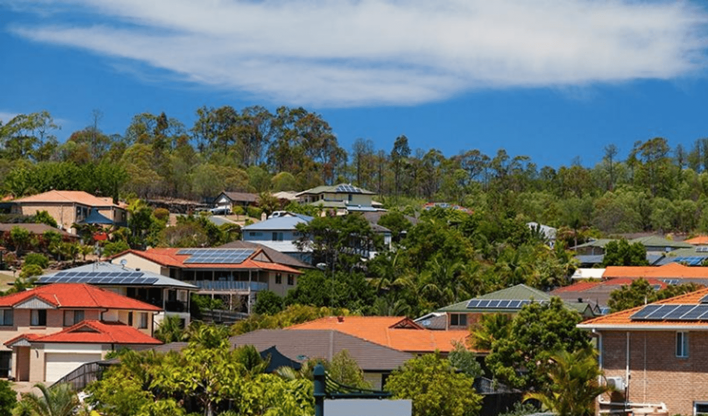 Houses with solar panels fitted to the roofs.