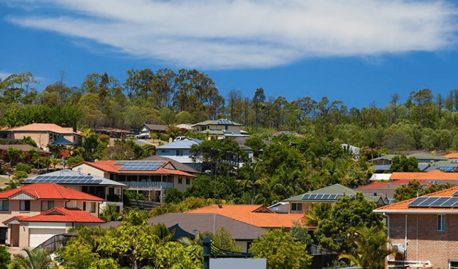 Houses with solar panels fitted to the roofs.