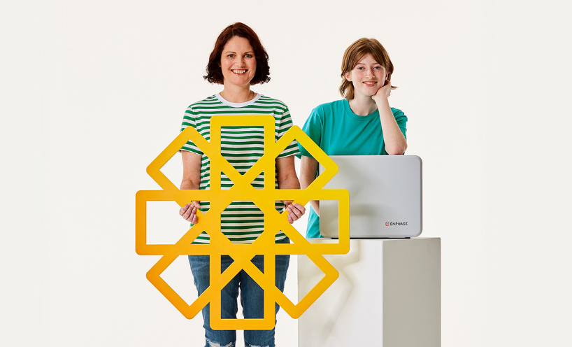 Solar battery rebate Family holding solar battery and yellow cardboard sun