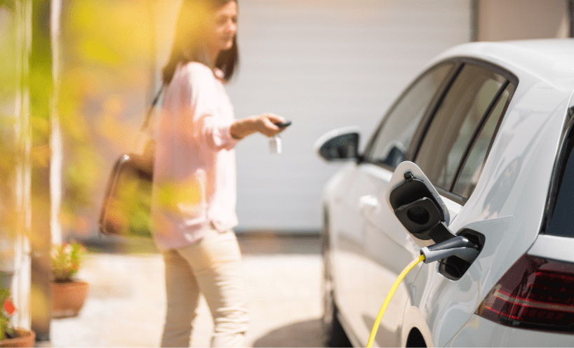 lady is locking her electric vehicle